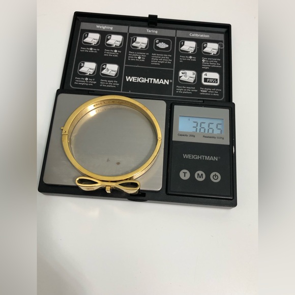 Kate Spade New York Goldtone Bow Bangle Bracelet . - Picture 3 of 9